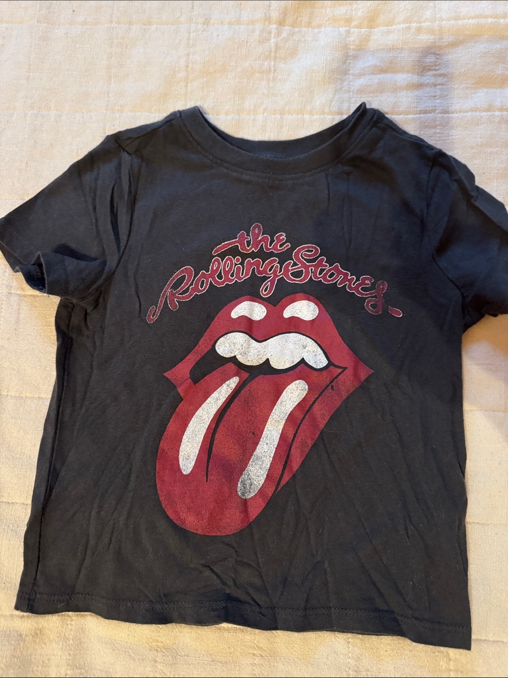 the Rolling Stones Black Kids Short-Sleeve Tee with Red Tongue Graphic